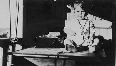 StateLibQld_1_115508_Young_child_listening_to_a_radio,_1920-1930.jpg